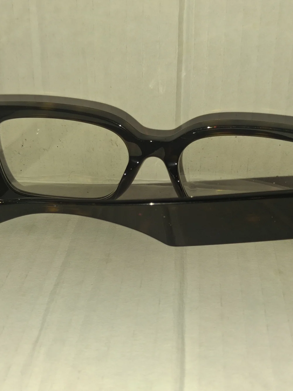 Versace VE3362U eyeglasses feature a bold, rectangular black frame with thick te